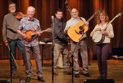 Jason Carter Band performing bluegrass on stage with fiddle, mandolin, guitar and banjo